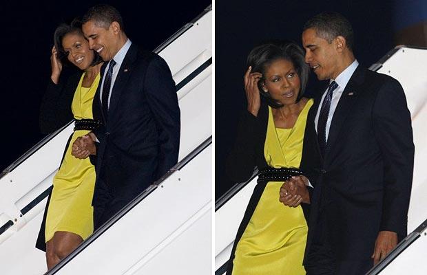 奥巴马夫人惊艳时装秀/图 US President Barack Obama (R) and First Lady Michelle Obama walk down the steps of Air Force One after arriving at Stansted International Airport outside London
